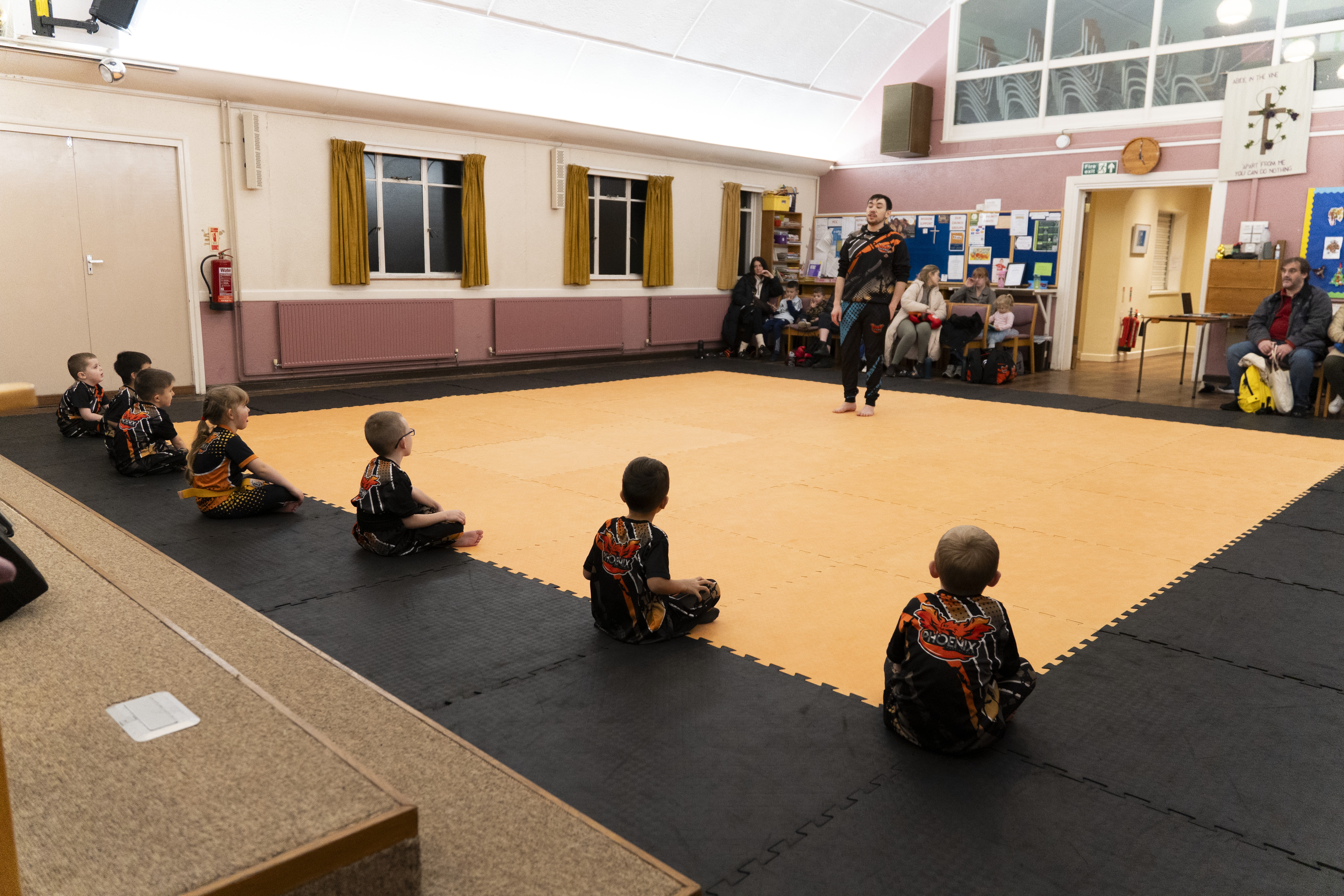 Children learning class structure and routines in a Kids Kickboxing session