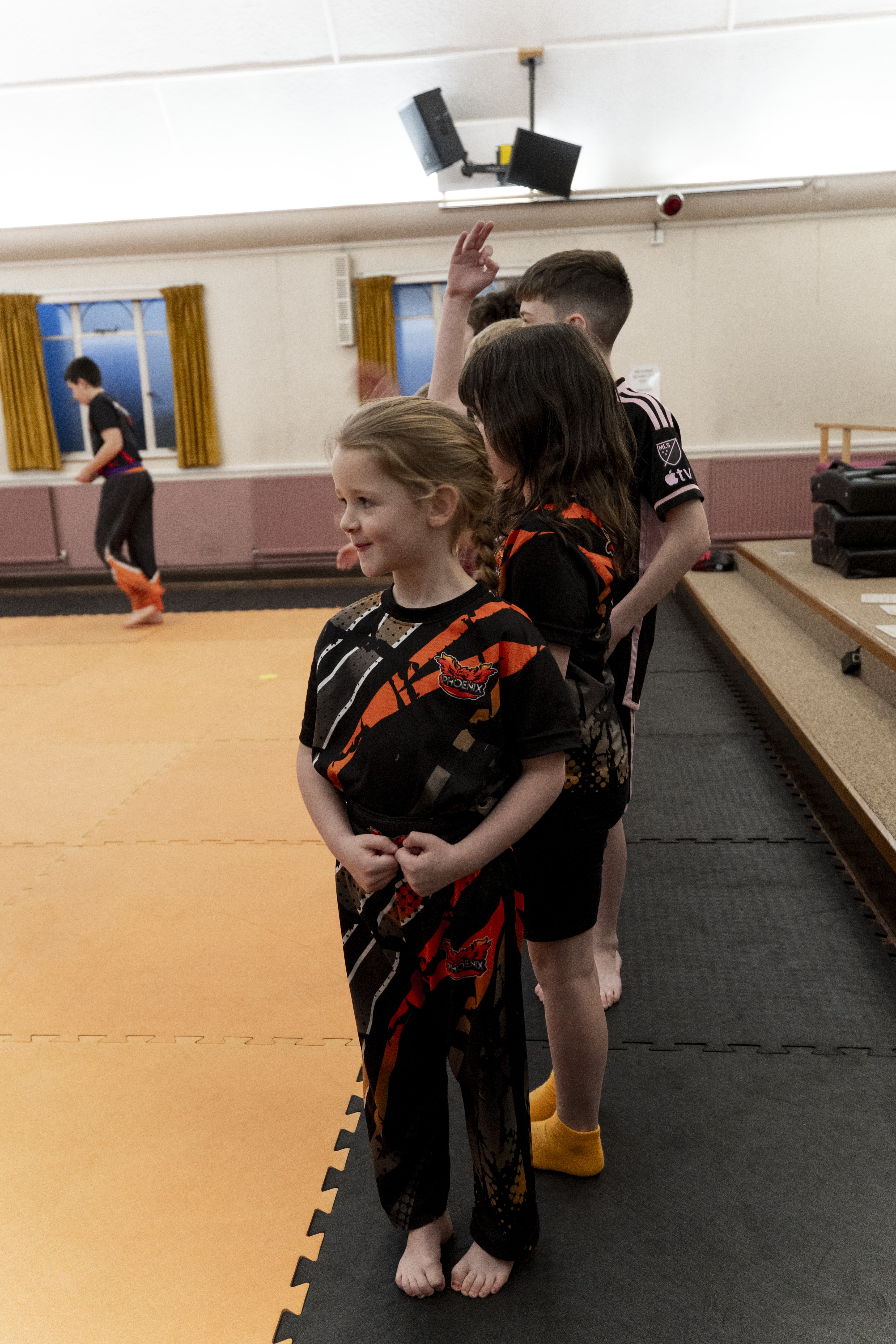 Junior student arriving and meeting the coach