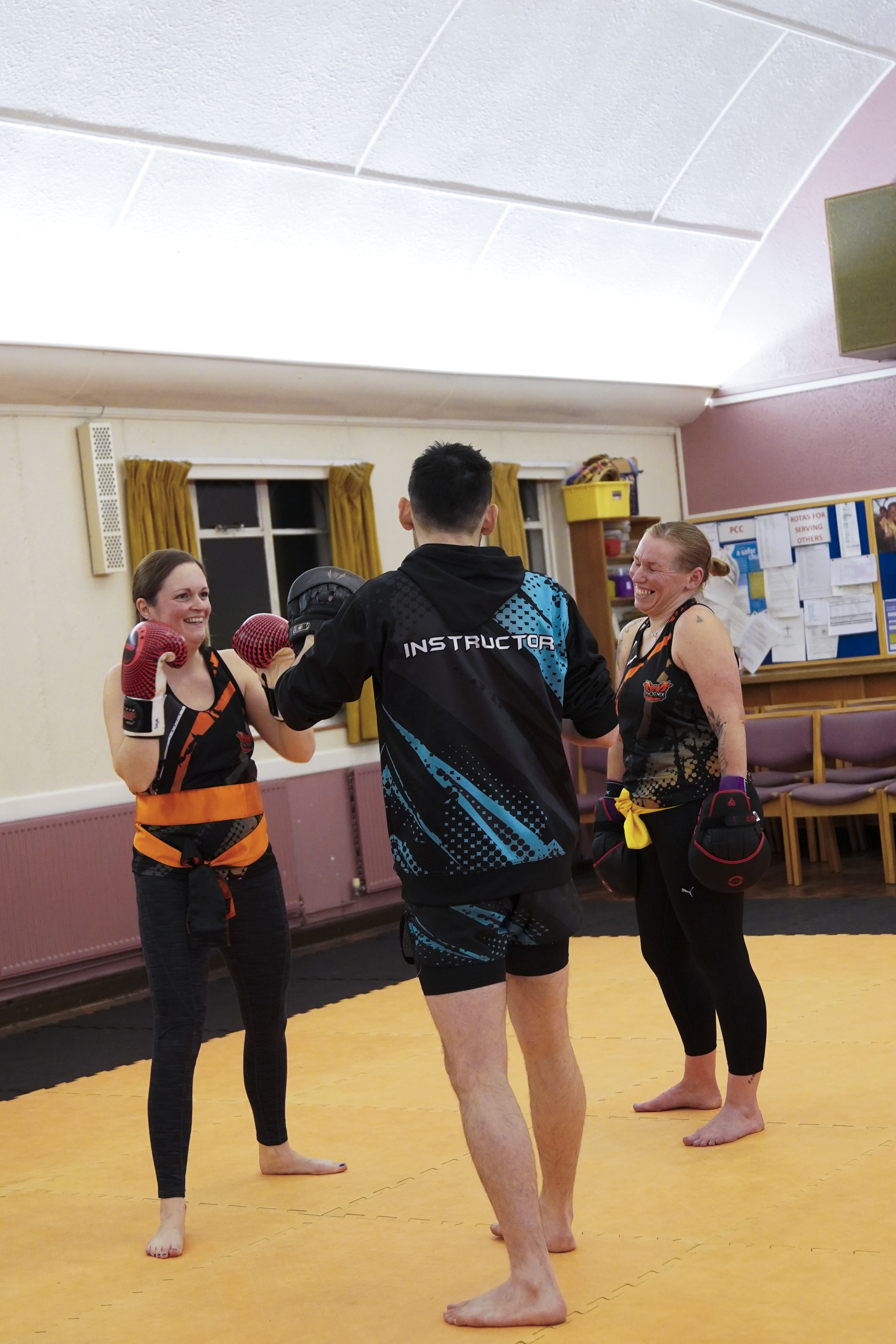 Women training in a positive kickboxing environment